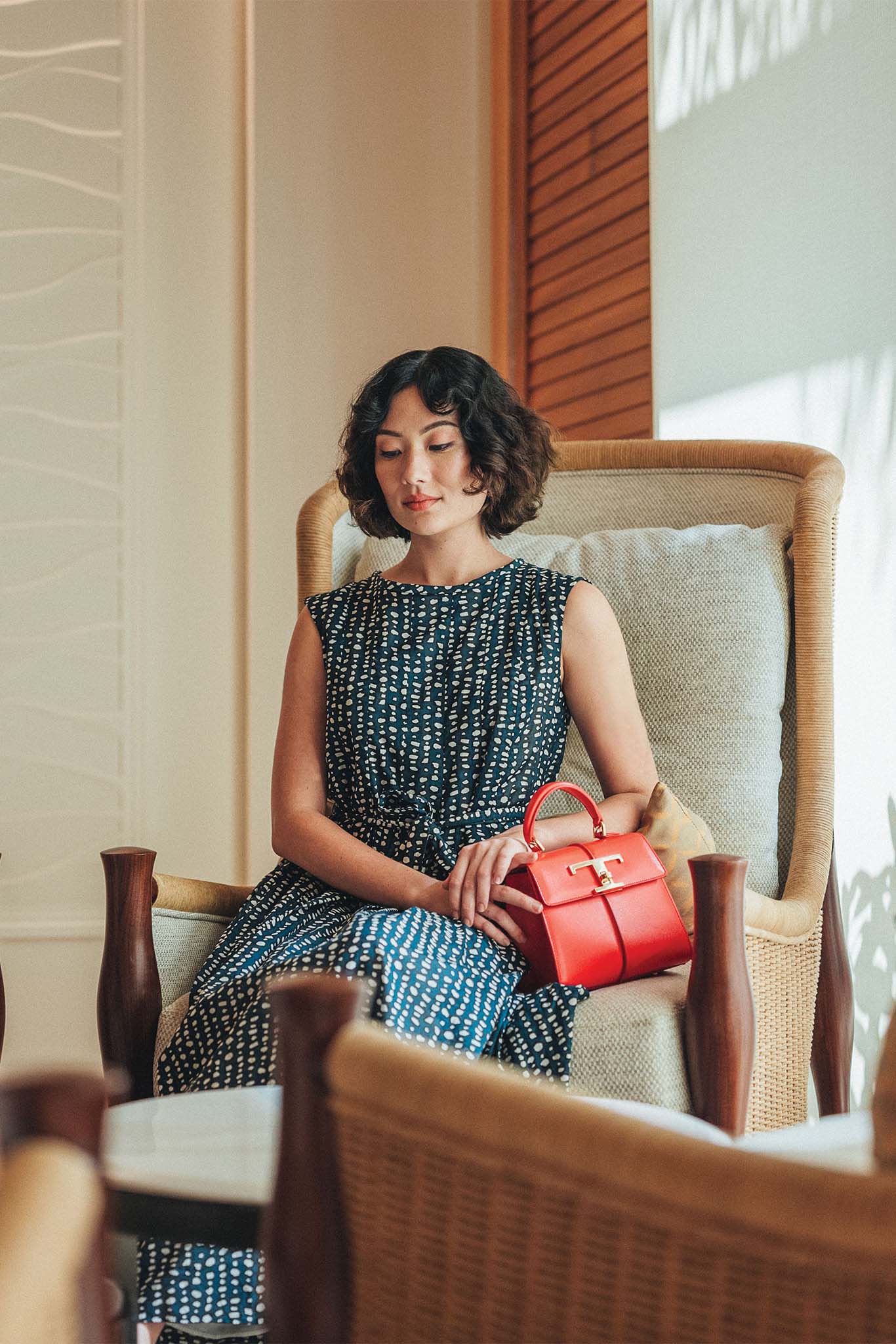 Max Mara Rosetta sleeveless belted midi dress from Saks Fifth Avenue. T Timeless bag from TOD’s.