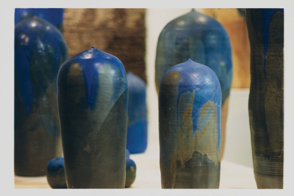 a group of blue and brown pottery