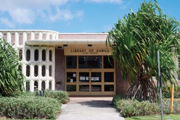 a library building with glass doors